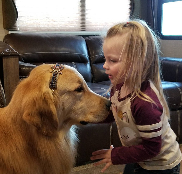 jaxson playing with his young human friend